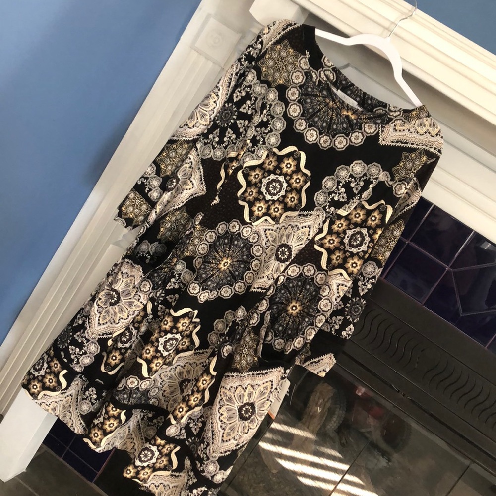 NEW! Three quarter sleeve pocketed swing dress